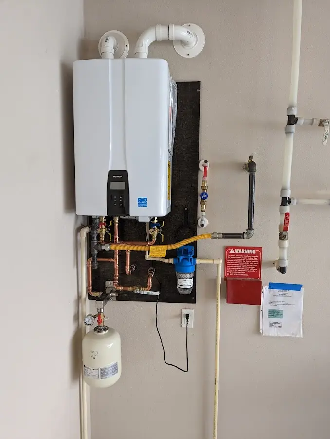 Professional plumber installing copper piping in a Port Arthur home